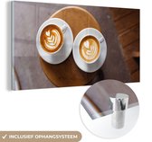 MuchoWow® Glass Painting - Deux tasses de café avec du latte art sont présentées d'en haut - 40x20 cm - Peintures sur Verre Acrylique - Photo sur Glas