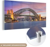 MuchoWow® Glasschilderij 120x60 cm - Schilderij acrylglas - Skyline van Sydney en de Sydney Harbour Bridge in Australië - Foto op glas - Schilderijen