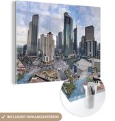 MuchoWow® Glasschilderij 120x90 cm - Schilderij acrylglas - Schitterende luchtfoto van Manila - Foto op glas - Schilderijen