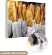 MuchoWow® Glasschilderij 40x30 cm - Schilderij acrylglas - Stokbroden in een bakkerij - Foto op glas - Schilderijen