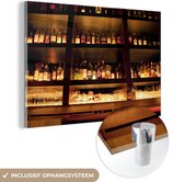 MuchoWow® Glasschilderij 120x80 cm - Schilderij acrylglas - Drink flessen op en boven de bar - Foto op glas - Schilderijen