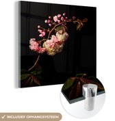 MuchoWow® Glasschilderij 50x50 cm - Schilderij acrylglas - Een kersenbloesem tegen een zwarte achtergrond - Foto op glas - Schilderijen