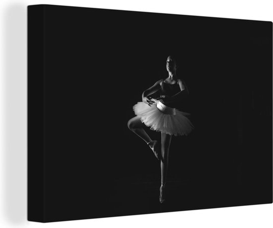 Canvas Schilderij een jonge ballerina op een zwarte achtergrond - zwart wit - Wanddecoratie