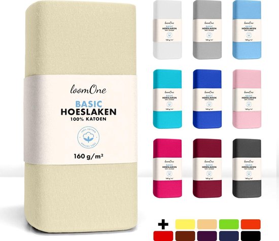 Opstelling van hoeslakens in verschillende kleuren, waaronder crème, grijs, lichtblauw, turkoois, donkerblauw, roze, fuchsia, bordeauxrood en zwart.