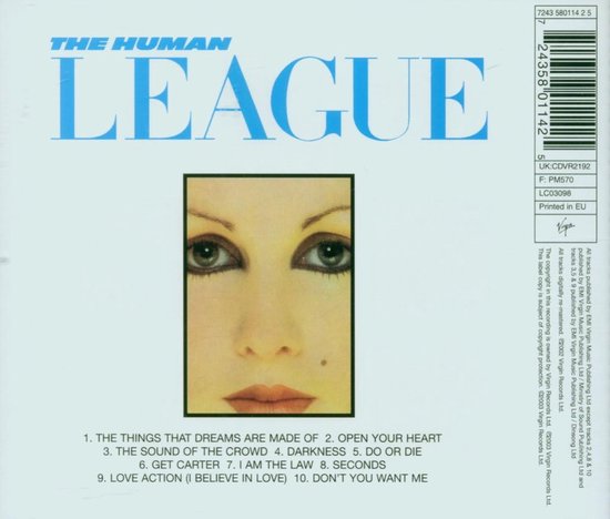Close-up van een gezicht met dramatische oogmake-up en rode lippen. De bandnaam 'THE HUMAN LEAGUE' staat bovenaan.