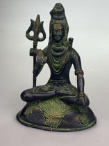 Shiva zittend