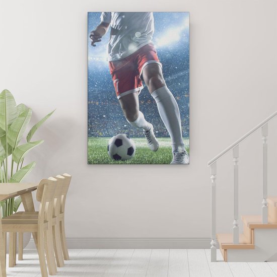 Artaza Tableau sur toile Joueur de football avec le ballon dans le stade -  120x60 