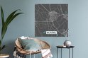 Grijze muursticker met stadskaart van Bladel, Nederland, met witte en blauwe lijnen, boven een fauteuil.