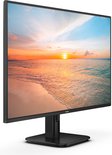 Zwarte Philips monitor met een zonsondergang aan zee op het scherm, en een vierkante voet.