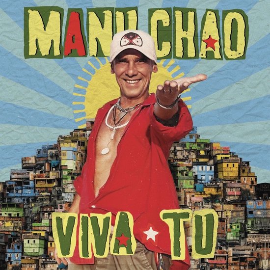 Manu Chao porte une veste rouge et une casquette, avec un soleil et une ville en arrière-plan. "MANU CHAO VIVA TU" est écrit.