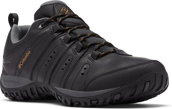 Chaussure de marche Columbia noire, vue de trois quarts, avec logo orange 'Columbia' sur le côté.