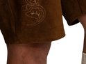 Culotte de leder brun avec motifs floraux brodés sur l'ourlet.