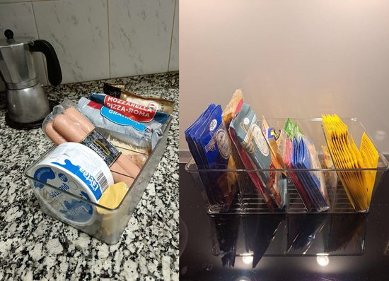 Twee doorzichtige opbergbakken, gevuld met etenswaren zoals worst, kaas, groenten en verpakkingen. De bakken zijn geplaatst op een keukenblad.
