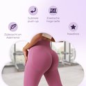 Roze naadloze sportlegging met hoge taille, subtiele push-up en ademend materiaal.