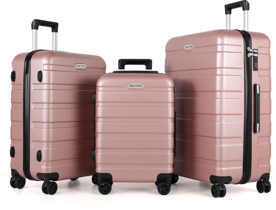 Set van drie rosé gouden koffers met wieltjes en uitschuifbare handvatten.