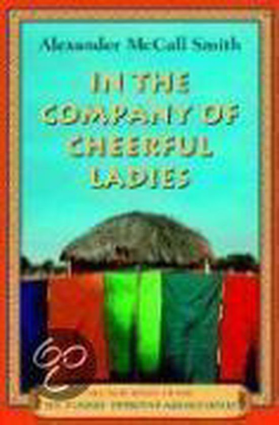Boek "In The Company Of Cheerful Ladies" van Alexander McCall Smith. Kleurrijke sjaals hangen te drogen.