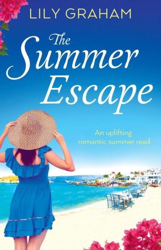 Boek "The Summer Escape" door Lily Graham. Een vrouw in blauwe jurk met strohoed staat op het strand met zee en witte gebouwen.