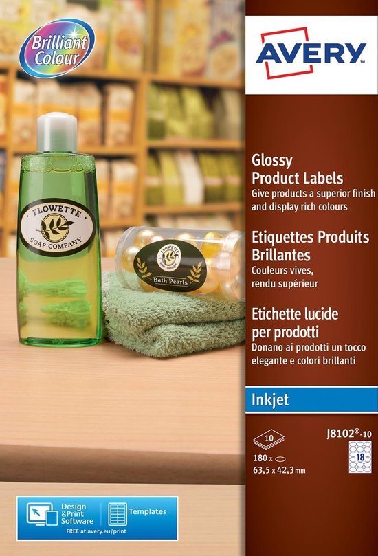 Emballage d'étiquettes de produits brillantes Avery pour imprimantes jet d'encre. Une bouteille de savon Flowette et un pot de 'Bath Pearls' reposent sur une serviette verte.