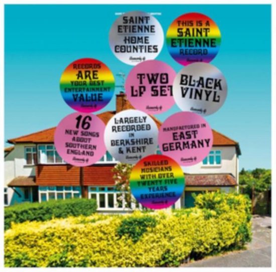 Albumhoes met cirkels over een huis. Tekst: "SAINT ETIENNE HOME COUNTIES", "THIS IS A SAINT ETIENNE RECORD", "RECORDS ARE YOUR BEST ENTERTAINMENT VALUE", "TWO LP SET", "BLACK VINYL", "16 NEW SONGS ABOUT SOUTHERN ENGLAND", "LARGELY RECORDED IN BERKSHIRE & KENT", "MANUFACTURED IN EAST GERMANY", "SKILLED MUSICIANS WITH OVER TWENTY FIVE YEARS EXPERIENCE".
