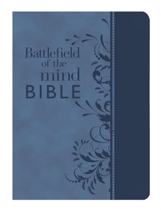 Bible bleue avec le texte 'Battlefield of the mind BIBLE' et des décorations florales sur le côté droit.