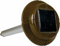 Bruine solar ongedierteverjager met een metalen staafje en een zonnepaneel bovenop.
