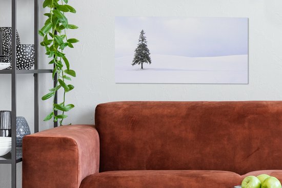 Tableau sur toile Un vide enneigé avec un sapin - 80x40 cm - Décoration murale