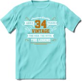 34 Jaar Legend T-Shirt | Goud - Wit | Grappig Verjaardag en Feest Cadeau Shirt | Dames - Heren - Unisex | Tshirt Kleding Kado | - Licht Blauw - S