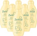 Vijf flessen Zwitsal anti-klit shampoo met zwaan- en kuikenprint.