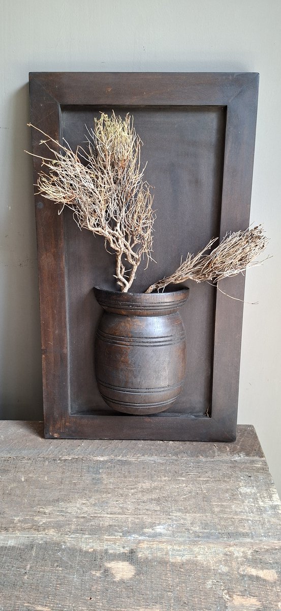 Houten wandpaneel met pot