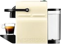 Machine à café à capsules Nespresso Inissia crème avec une tasse d'expresso et réservoir d'eau.