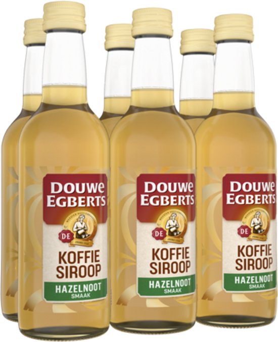 Zes flesjes Douwe Egberts koffiesiroop hazelnoot, met etiket 'Koffie Siroop Hazelnoot Smaak'.