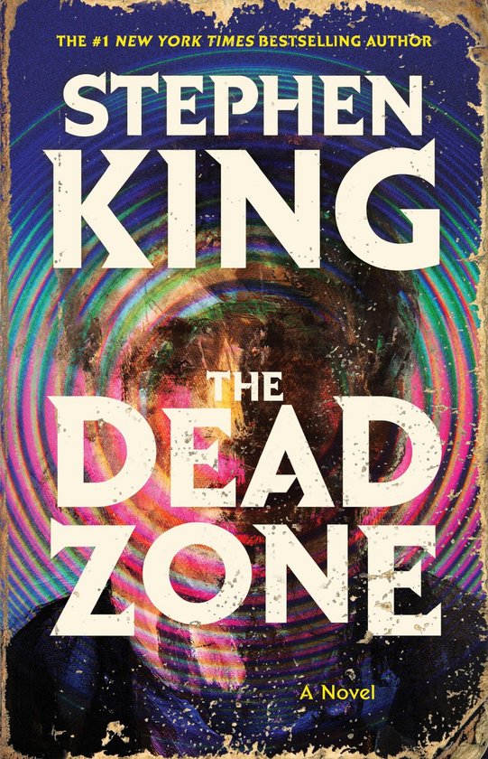 Couverture du livre 'The Dead Zone' de Stephen King, avec une spirale circulaire psychédélique et le titre en grandes lettres blanches.