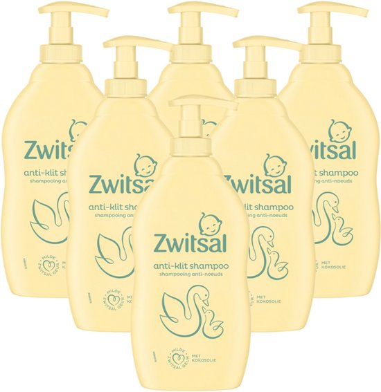Groep van zes crèmekleurige Zwitsal anti-klit shampooflessen met pompsysteem.