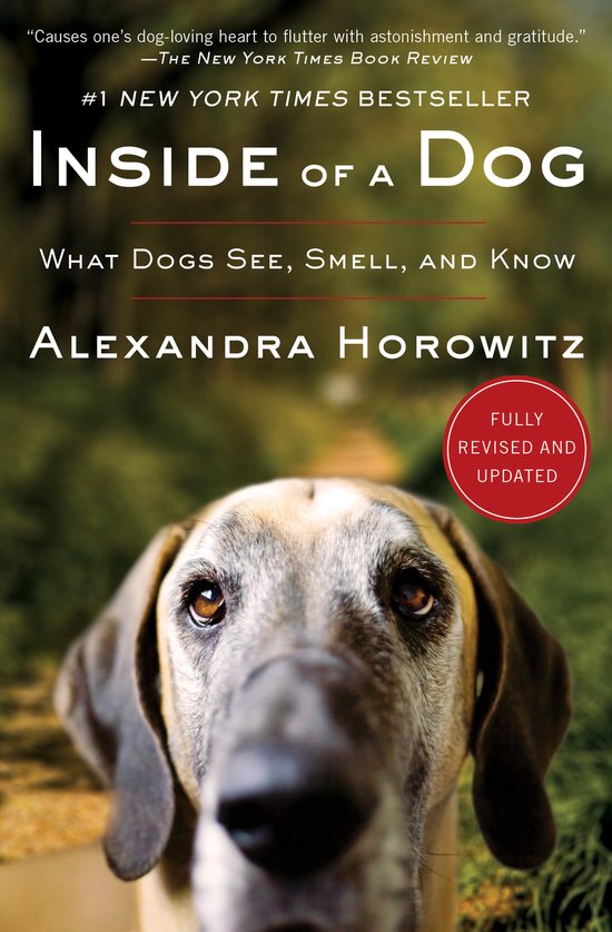 Boekcover van 'Inside of a Dog', met een close-up van een hondengezicht en de titel.