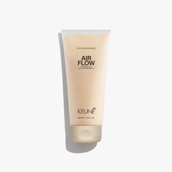 Keune Air Flow air dry styling cream 200 ml tube met beige dop. Geel getinte crème met kleine oranje stipjes.