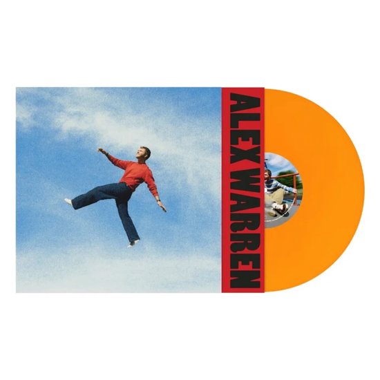 Disque vinyle orange avec "ALEX WARREN" en lettres rouges sur la pochette. Un homme en pull rouge et pantalon bleu flotte dans un ciel bleu.