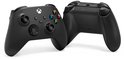 Zwarte Xbox controller met gekleurde A, B, X, Y knoppen, naast de achterkant van de controller.