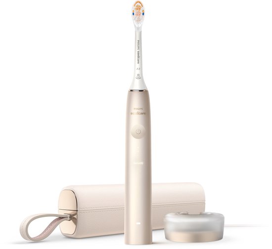Champagnekleurige elektrische tandenborstel met opzetborstel, oplaadstation en luxe case.