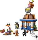 Restaurant LEGO Durrr Burger avec des figurines, un jouet hamburger, une grenouille et un squelette.