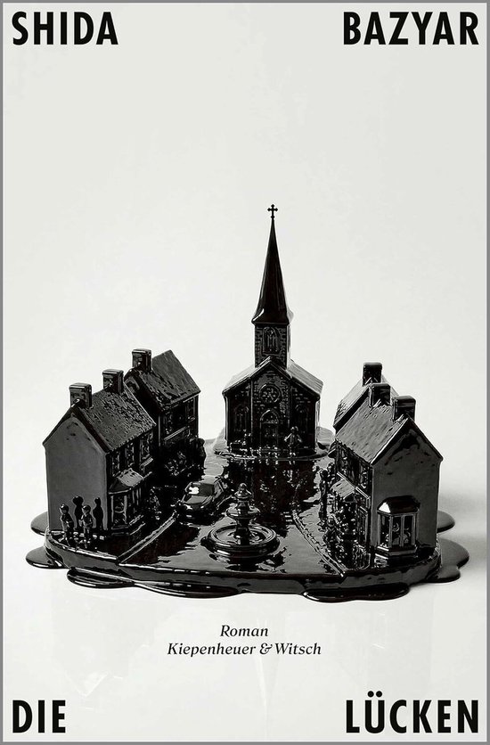Zwart miniatuurdorp met kerk, huizen en fontein, 'Die Lücken' roman