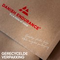 Emballage en carton brun avec texte rouge 'DANISH ENDURANCE' et logo. 'Goodbye plastic bags. Hello recycled packaging.'