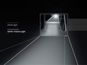 Diagram van een ASYM-TriZone Light™ bureaulamp die licht uitstraalt op een bureau.