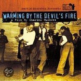 Warming By The Devils Fire - A