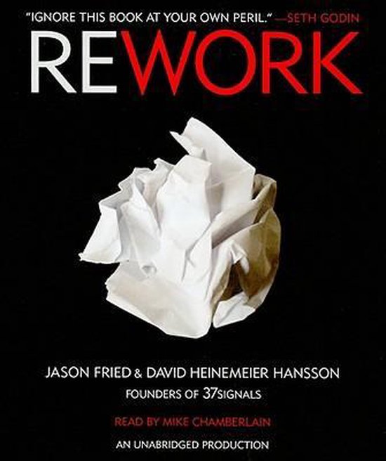 Boekomslag van 'Rework' met de titel in grote letters. In het midden een verkruimelde witte papieren bal op een zwarte achtergrond. "IGNORE THIS BOOK AT YOUR OWN PERIL."-SETH GODIN.