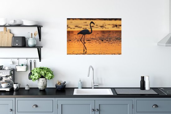 Poster Het silhouet van een flamingo bij zonsondergang - 60x40 cm