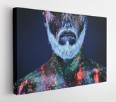 Canvas schilderij - Concept. Portrait of a bearded man. The man is painted in ultraviolet powder  -     648695950 - 80*60 Horizontal