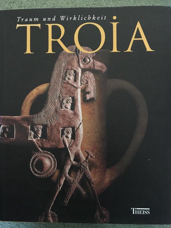 Boek "Troia: Traum und Wirklichkeit" met een afbeelding van een oud artefact.