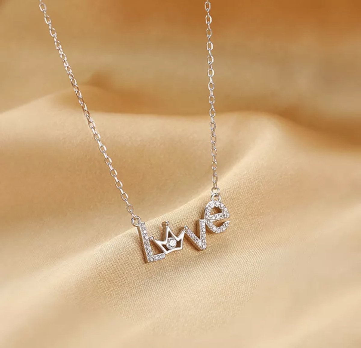 Zilveren ketting met hanger hart regenboog K3