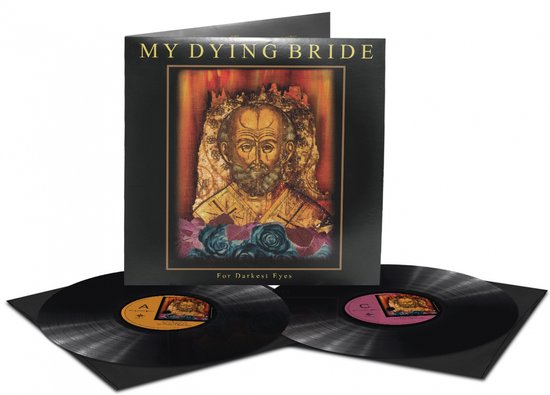 Dubbelvinyl hoes met 'MY DYING BRIDE' en 'For Darkest Eyes'. Afbeelding van een man boven bloemen. Twee zwarte platen met gekleurde labels.