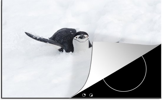 Inductie beschermer - Inductie Mat - Kookplaat beschermer - Een pinguïn glijdt op zijn buik door de sneeuw - 80x52 cm - Afdekplaat inductie -...